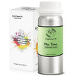 Fragrance oil bottle with green label and white cap next to its packaging on a white background