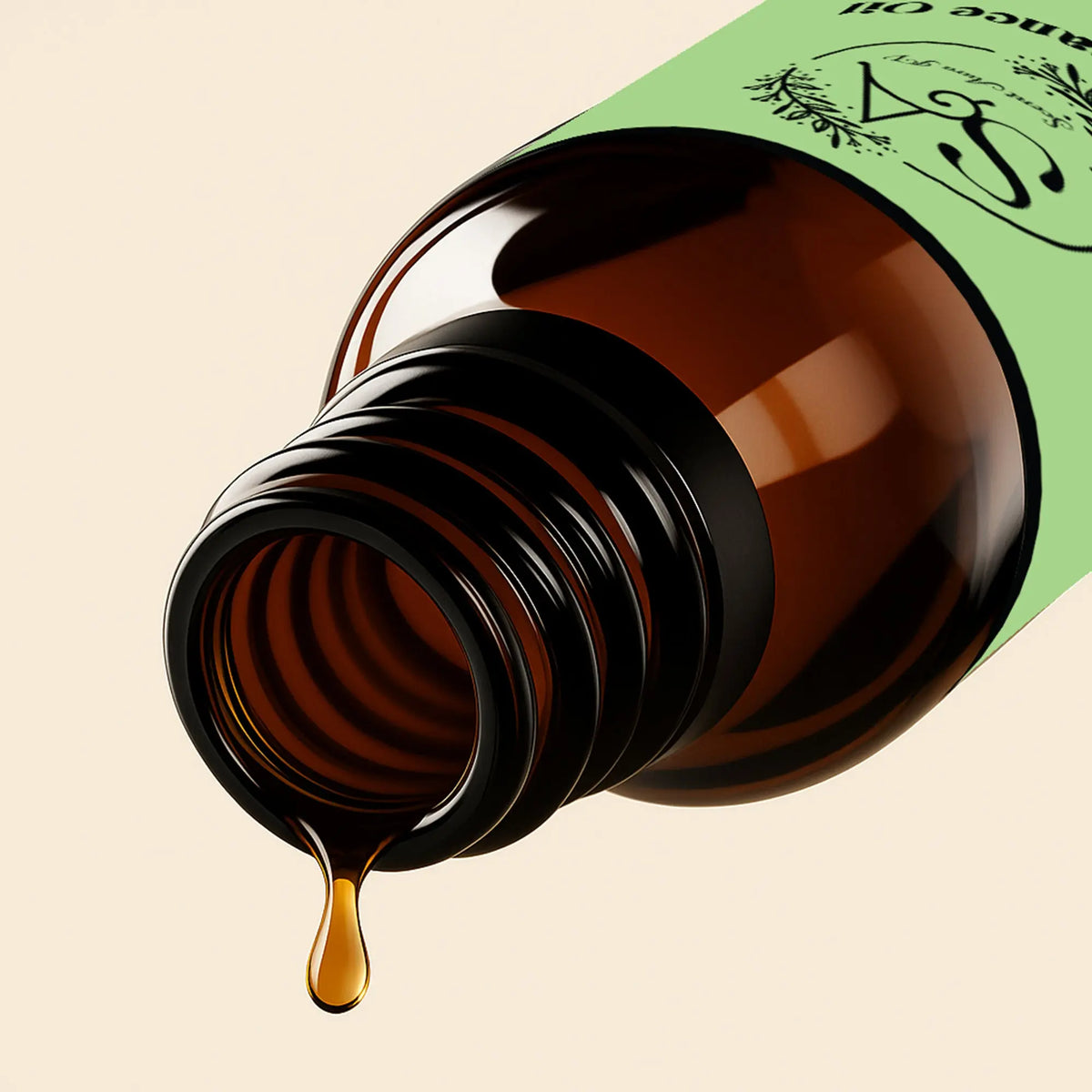 Brown glass bottle with green label and diffuser oil dripping, on beige background
