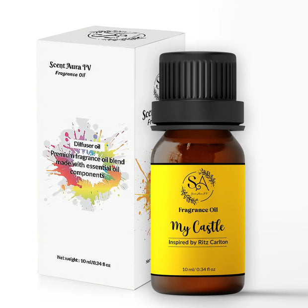 My Castle Fragrance oil bottle with yellow label and black cap next to its packaging on a white background